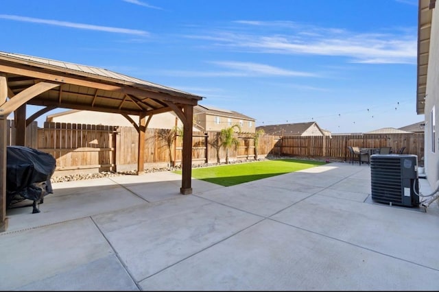 view of patio / terrace with a gazebo, area for grilling, and central AC