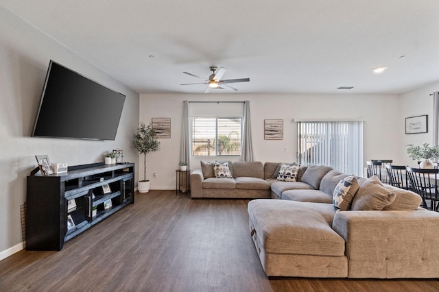 living room featuring ceiling fan and hardwood / wood-style floors