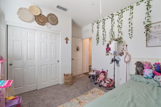 bedroom with carpet floors and a closet