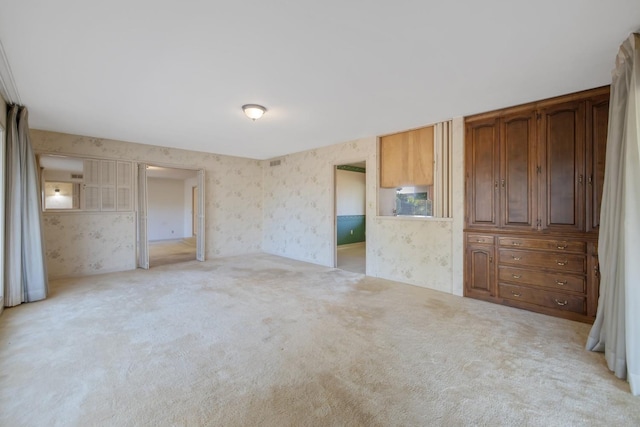 unfurnished bedroom featuring light colored carpet