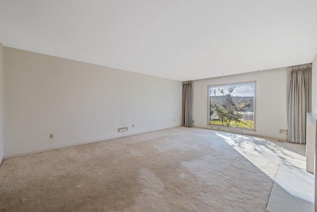 empty room featuring light colored carpet