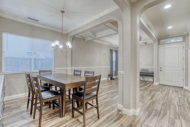 dining room featuring coffered ceiling, beamed ceiling, light hardwood / wood-style flooring, crown molding, and a notable chandelier