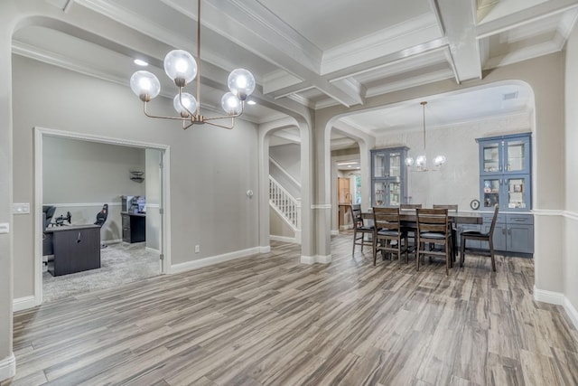 dining space featuring crown molding, hardwood / wood-style floors, beam ceiling, and a chandelier