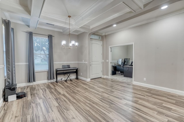 dining space featuring an inviting chandelier, light wood-type flooring, ornamental molding, beamed ceiling, and coffered ceiling