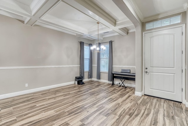 unfurnished dining area with light hardwood / wood-style floors, beam ceiling, a chandelier, and coffered ceiling