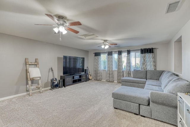 carpeted living room with ceiling fan