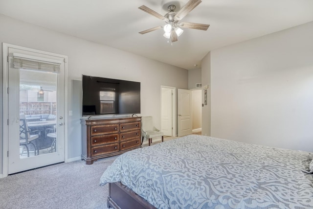 carpeted bedroom featuring access to exterior and ceiling fan