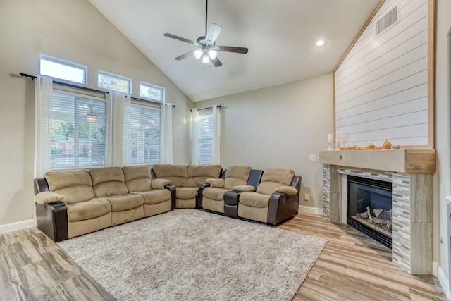 living room featuring high vaulted ceiling, light wood-type flooring, and ceiling fan