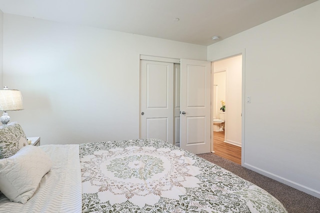 bedroom with carpet flooring and a closet