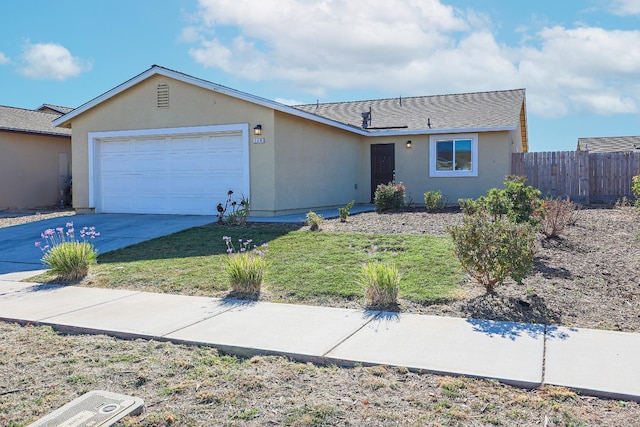 single story home with a front lawn and a garage