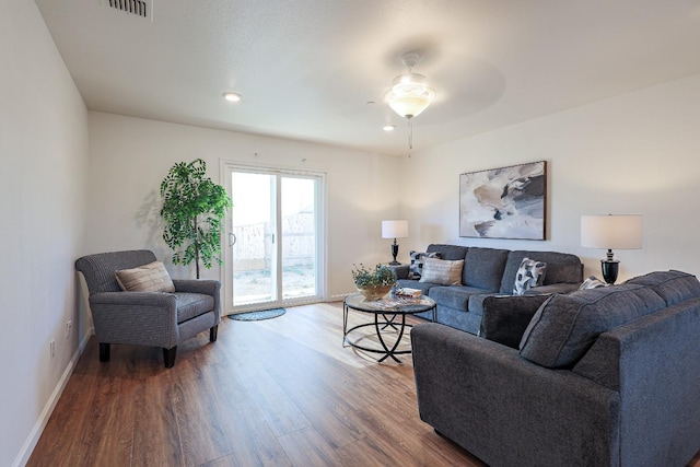 living room featuring ceiling fan and wood-type flooring