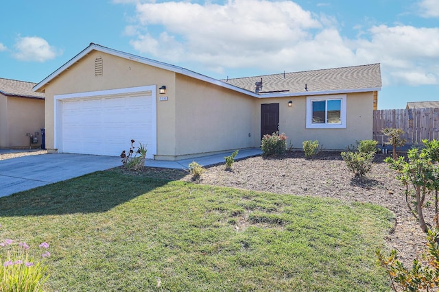 single story home with a garage and a front lawn