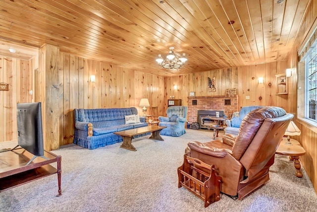 carpeted living room featuring an inviting chandelier, wooden walls, and wooden ceiling