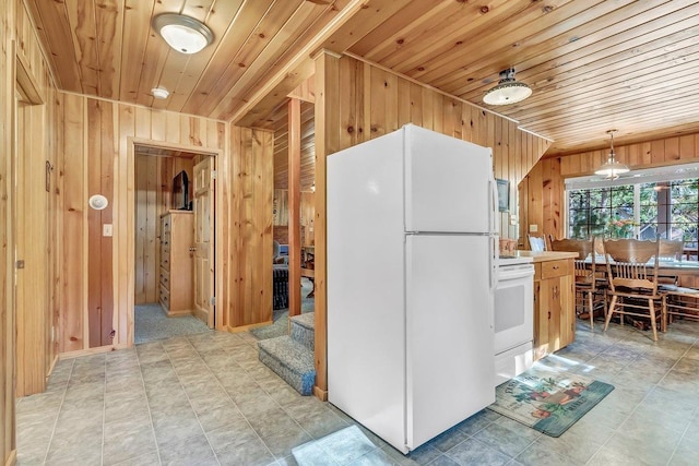 kitchen featuring wood walls, decorative light fixtures, white appliances, and wooden ceiling