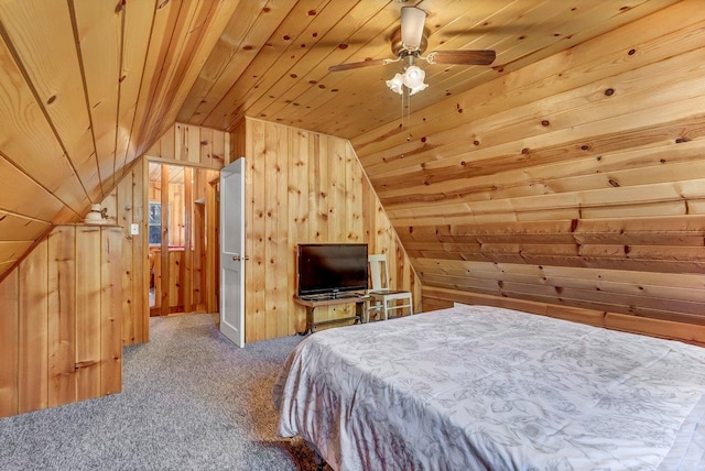 carpeted bedroom featuring lofted ceiling, wooden walls, ceiling fan, and wooden ceiling