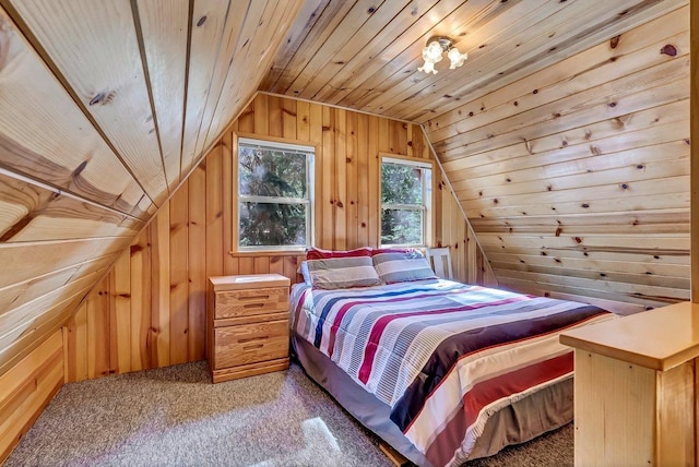 carpeted bedroom with wood ceiling, wooden walls, and lofted ceiling