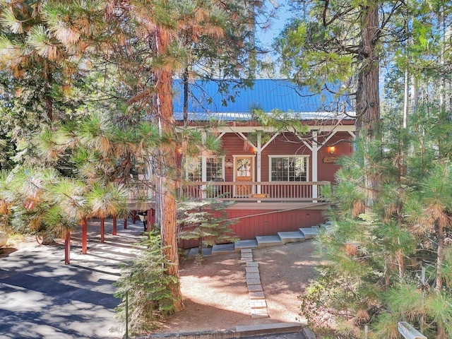 view of front facade with a wooden deck