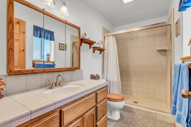 bathroom featuring backsplash, vanity, curtained shower, and toilet