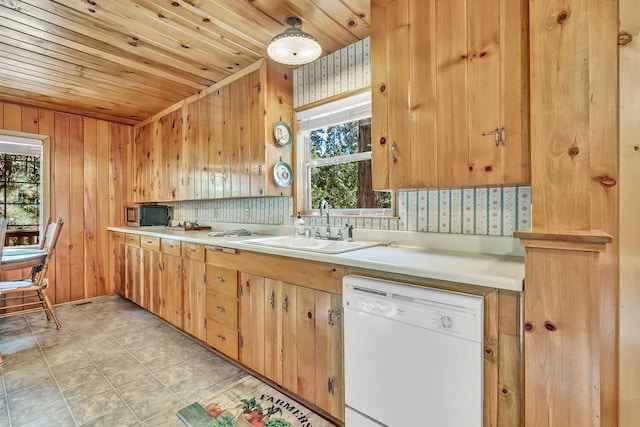 kitchen with wood walls, dishwasher, wooden ceiling, sink, and tasteful backsplash