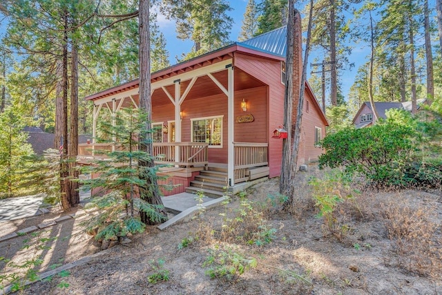 41816 N Dogwood Rd, Shaver Lake, CA 93664 - rustic home featuring a metal roof and a porch