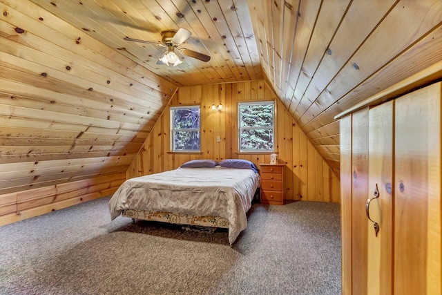 bedroom featuring lofted ceiling, wood ceiling, wooden walls, carpet flooring, and ceiling fan