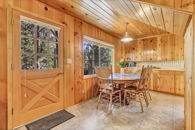 41816 N Dogwood Rd, Shaver Lake, CA 93664 - dining room featuring plenty of natural light, wood walls, and wood ceiling