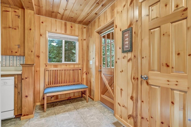 mudroom featuring wood walls and wooden ceiling