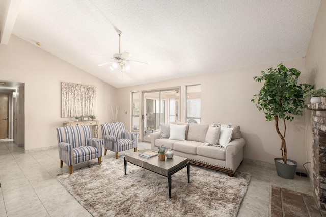 living room with ceiling fan, vaulted ceiling, a textured ceiling, and light tile patterned floors