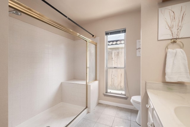 bathroom with walk in shower, vanity, toilet, and tile patterned flooring