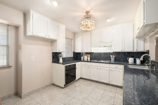 kitchen featuring sink, decorative backsplash, oven, and white cabinets