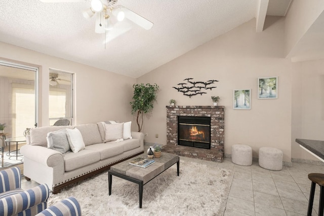 tiled living room with a brick fireplace, a textured ceiling, vaulted ceiling, and ceiling fan