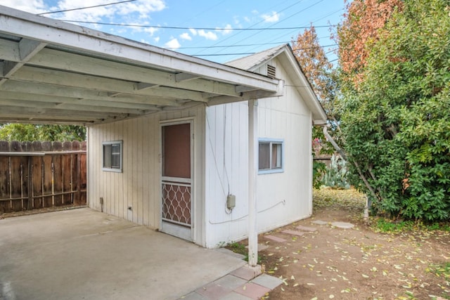 view of outbuilding featuring a carport