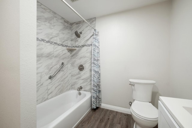 full bathroom featuring vanity, hardwood / wood-style floors, shower / tub combo, and toilet