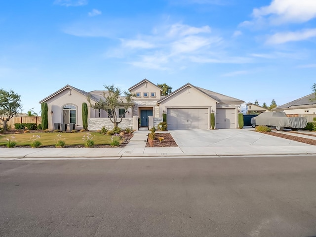 ranch-style house featuring a garage and a front yard