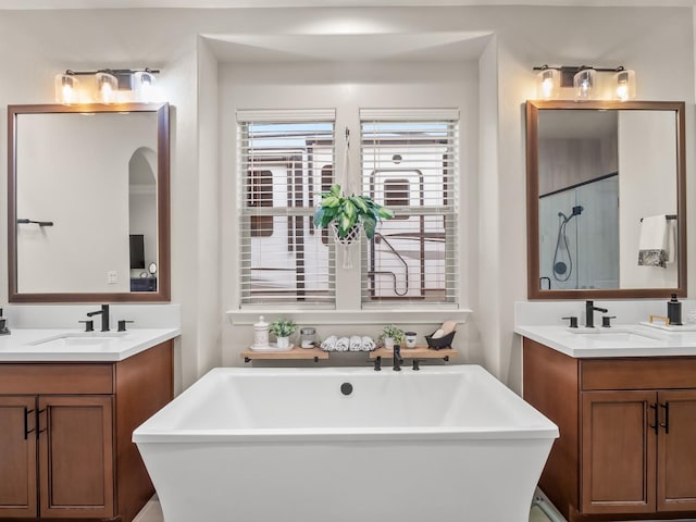 bathroom with vanity and plus walk in shower