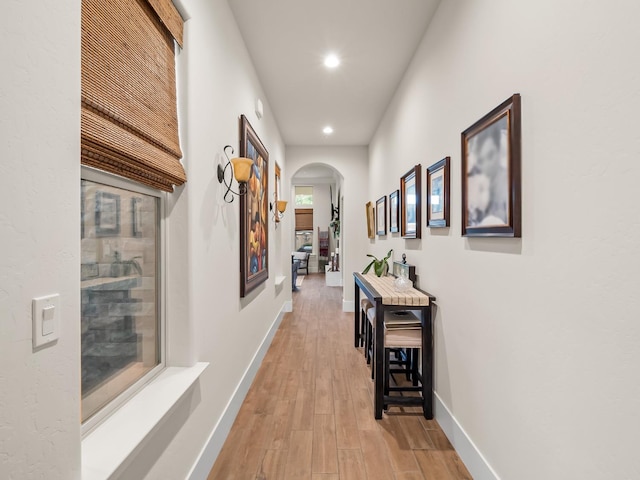 hall with hardwood / wood-style floors