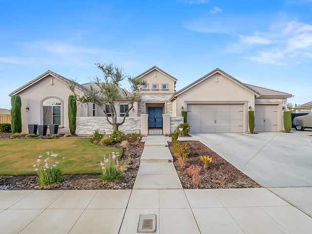 view of front facade featuring a front yard and a garage