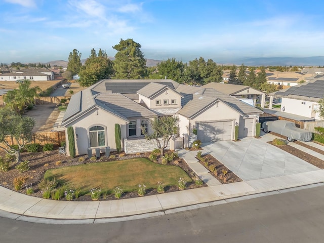 view of front of property featuring a front yard and a garage