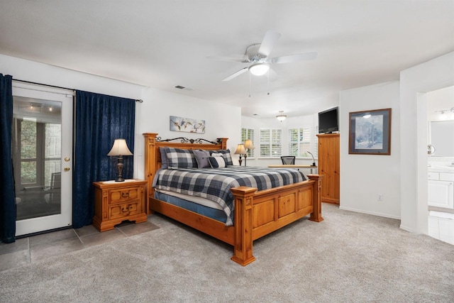 carpeted bedroom featuring connected bathroom, access to exterior, and ceiling fan