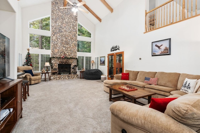 living room featuring high vaulted ceiling, beamed ceiling, carpet floors, and a stone fireplace