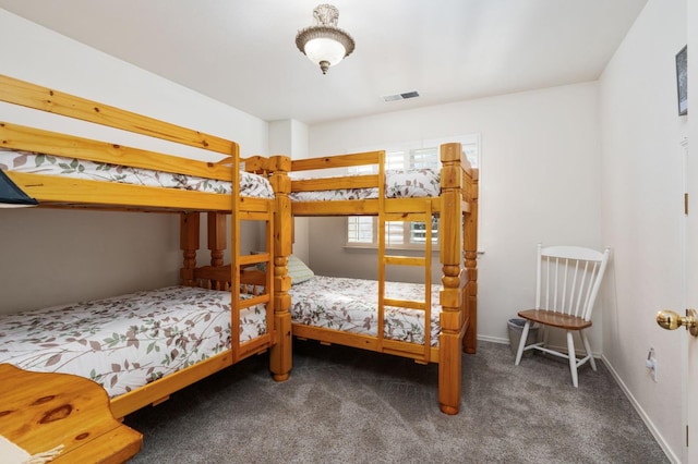 bedroom featuring dark carpet