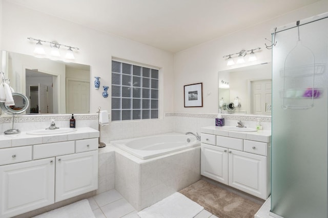 bathroom with vanity, shower with separate bathtub, and tile patterned floors