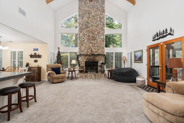 living room featuring beam ceiling, carpet, a fireplace, and high vaulted ceiling