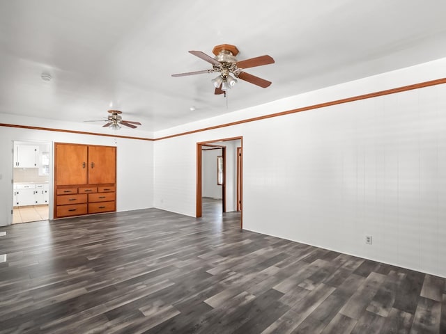 interior space featuring ceiling fan and dark hardwood / wood-style flooring