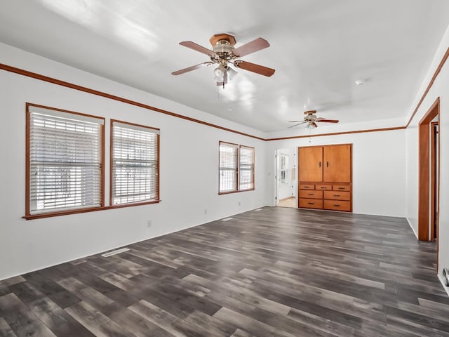 unfurnished living room with ceiling fan and dark hardwood / wood-style flooring