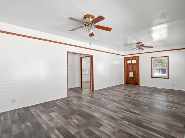 unfurnished living room with ceiling fan and dark hardwood / wood-style floors