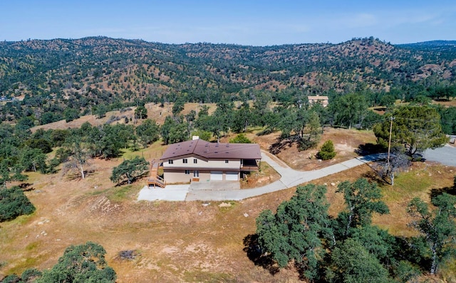 birds eye view of property with a mountain view