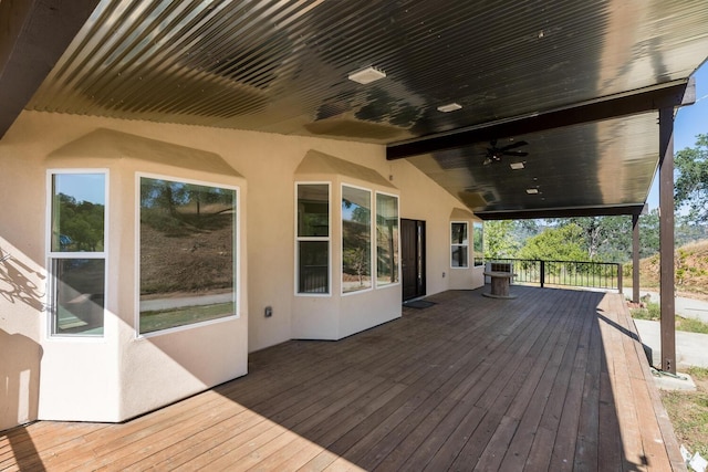 wooden terrace featuring ceiling fan