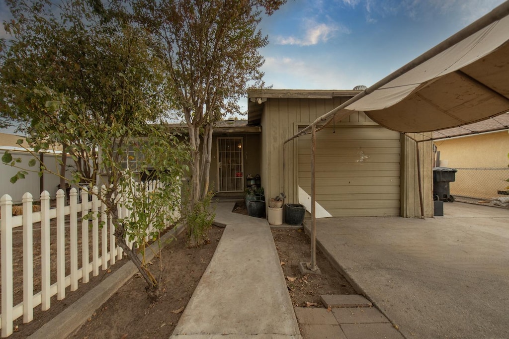 view of side of home with a patio area