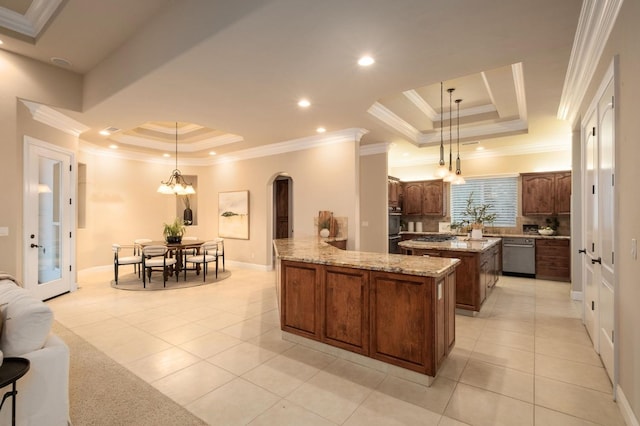 kitchen featuring a center island, crown molding, appliances with stainless steel finishes, and decorative light fixtures